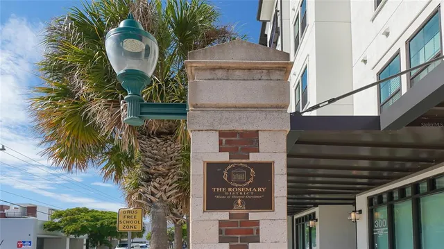 a front view of a house with a garden and plants
