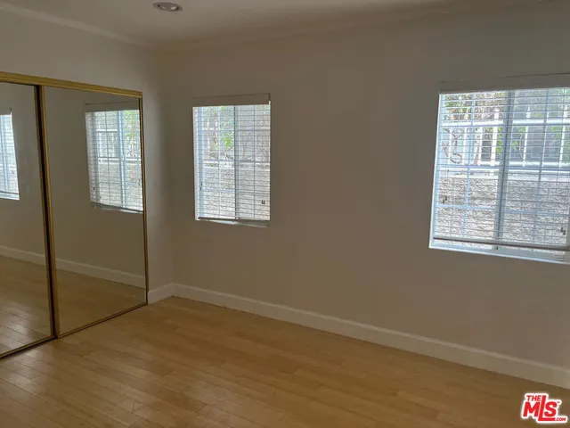 a view of an empty room with glass door