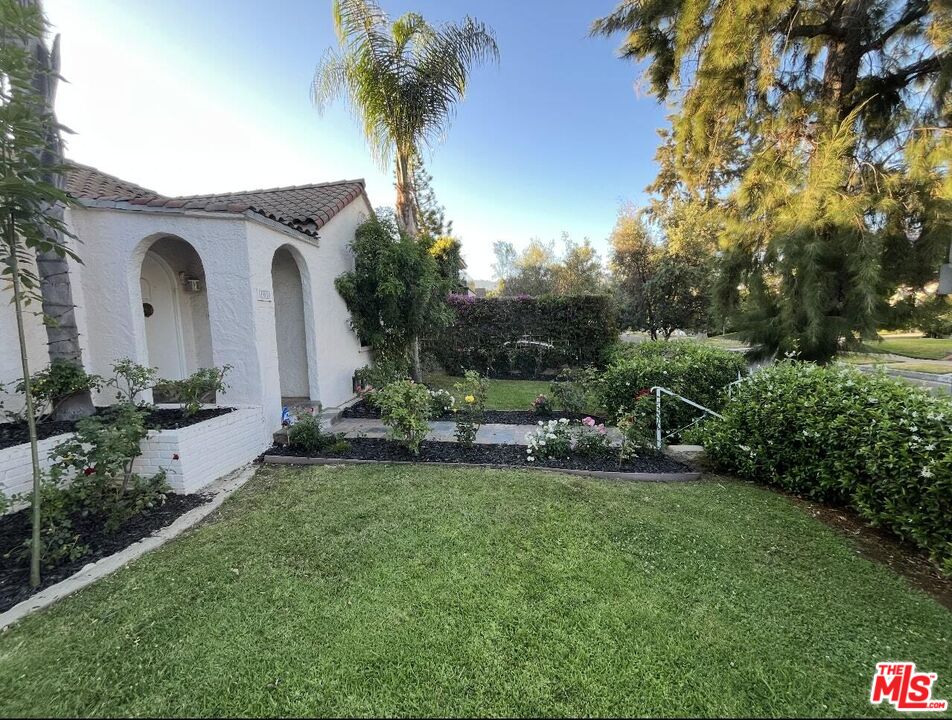101 North La Peer Drive Los Angeles, CA 90048 - Photo 2 of 33 a view of a house with a backyard and sitting area