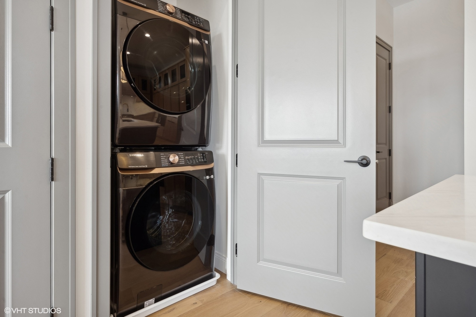 1615 West Irving Park Road, Unit 2N Chicago, IL 60613 - Photo 18 of 24 a view of a hallway with washer and dryer