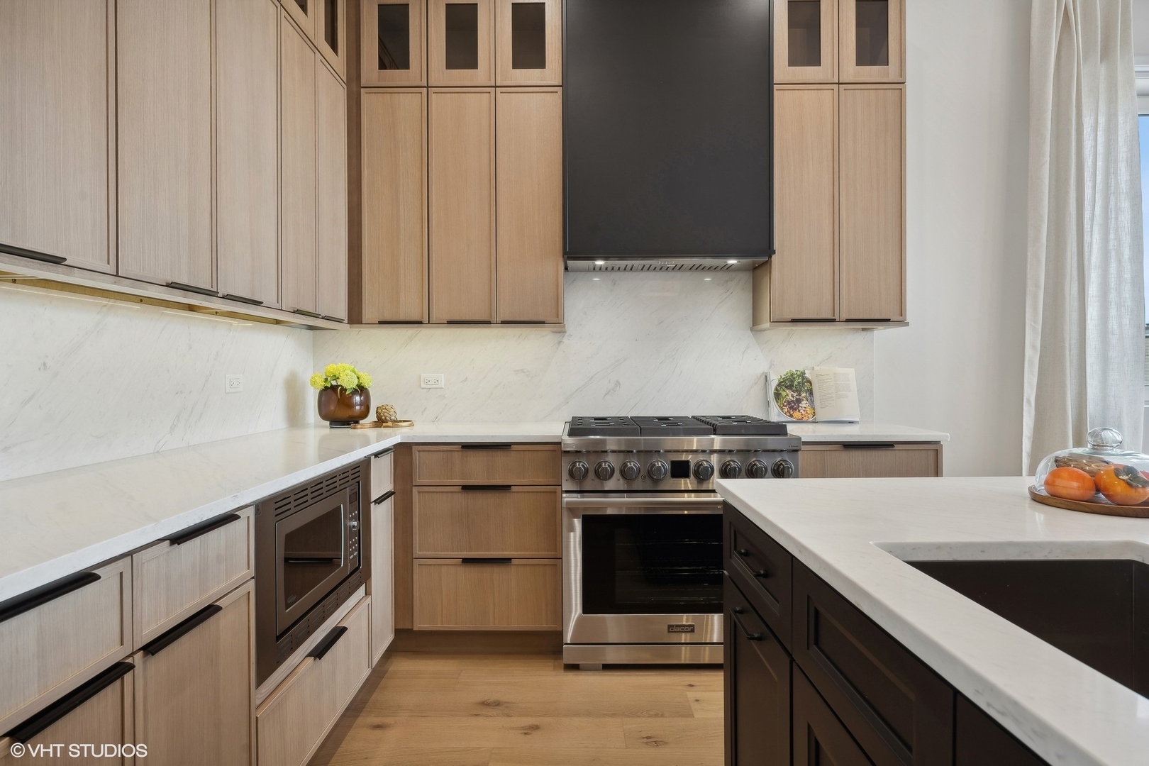1615 West Irving Park Road, Unit 2N Chicago, IL 60613 - Photo 4 of 24 a kitchen with stainless steel appliances granite countertop a sink a stove and a refrigerator