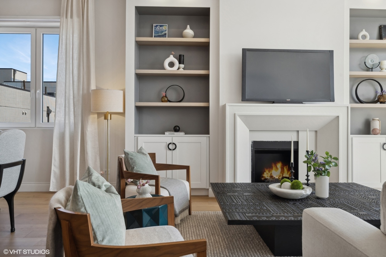 1615 West Irving Park Road, Unit 2N Chicago, IL 60613 - Photo 7 of 24 a living room with furniture and a fireplace