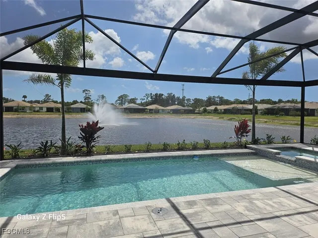 a view of a swimming pool with a yard