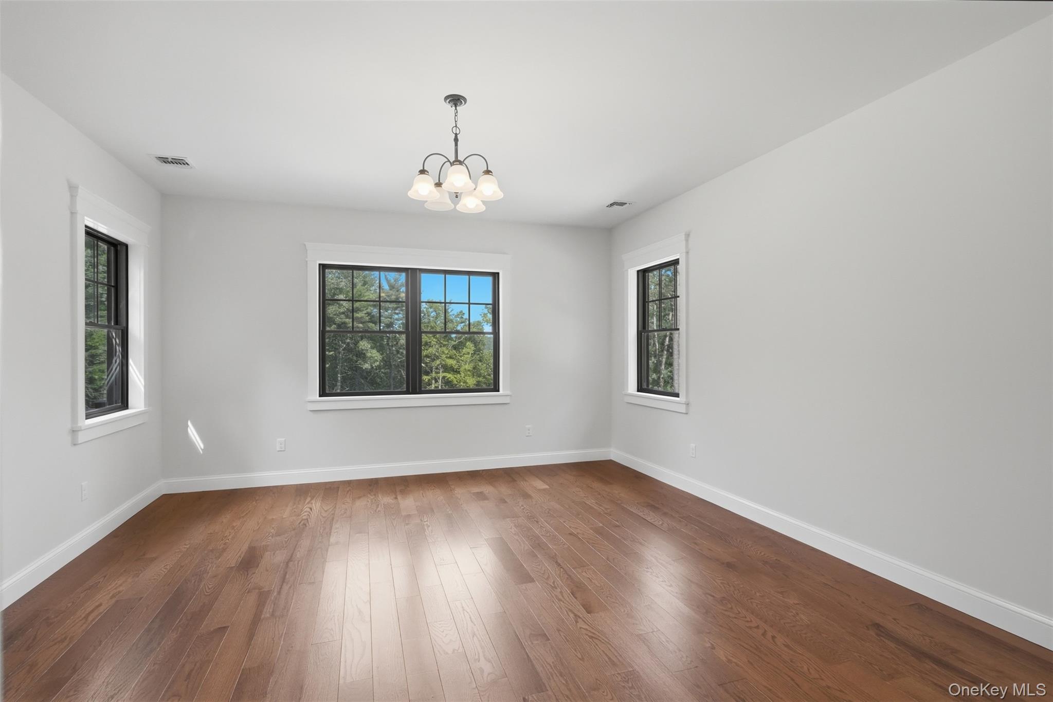 300 Van Tuyl Road Barryville, NY 12719 - Photo 33 of 50 a view of an empty room with wooden floor and a window