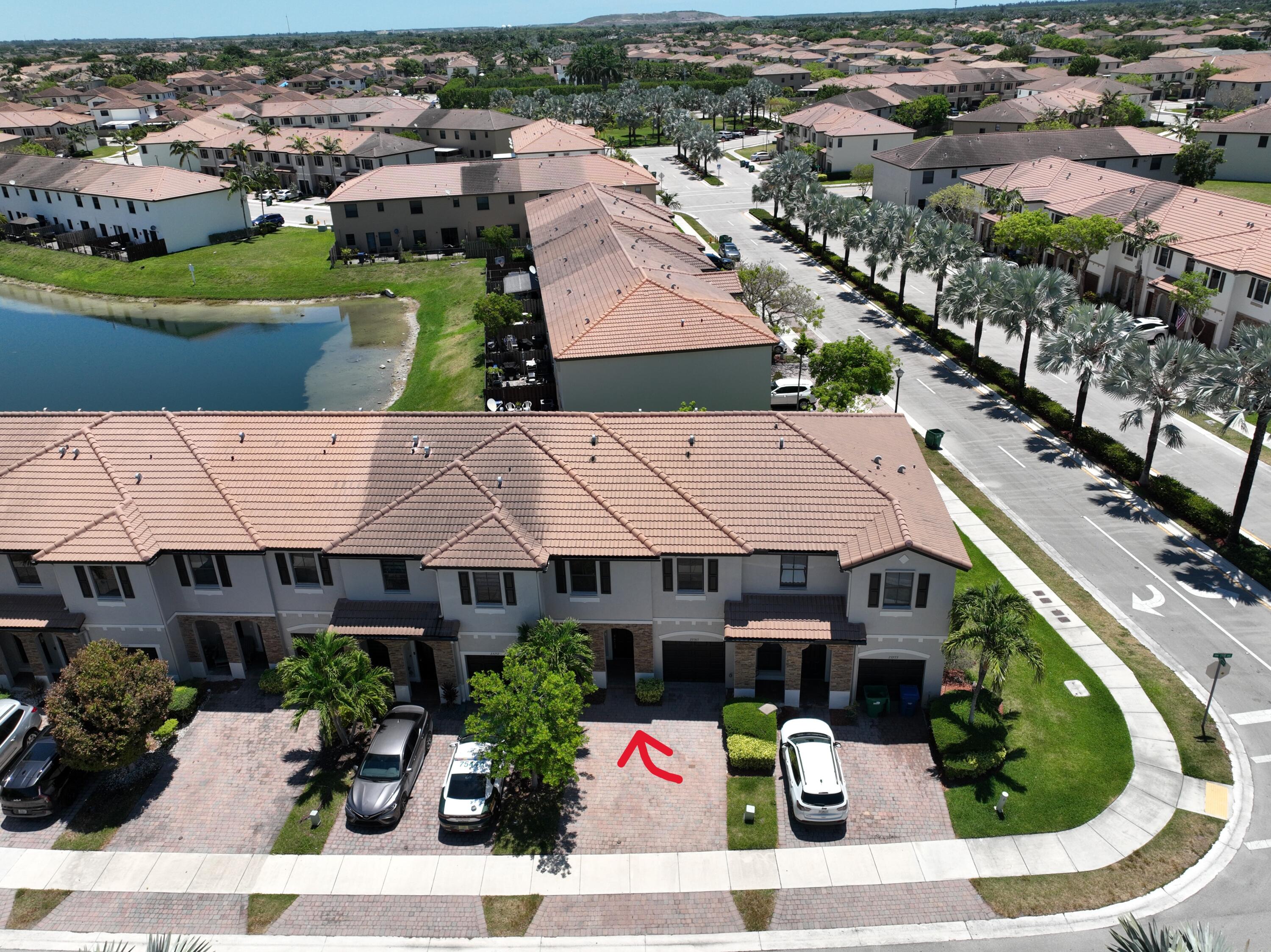 23765 Southwest 118 Avenue, Unit 23765 Homestead, FL 33032 - Photo 1 of 36 an aerial view of a house with a garden