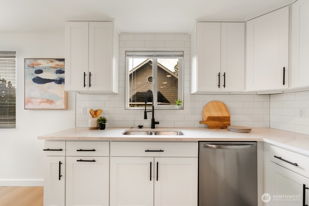 13121 Golden Given Road East Tacoma, WA 98445 - Photo 13 of 39 a kitchen with a sink and cabinets