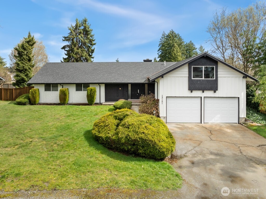 13121 Golden Given Road East Tacoma, WA 98445 - Photo 2 of 39 a front view of a house with garden
