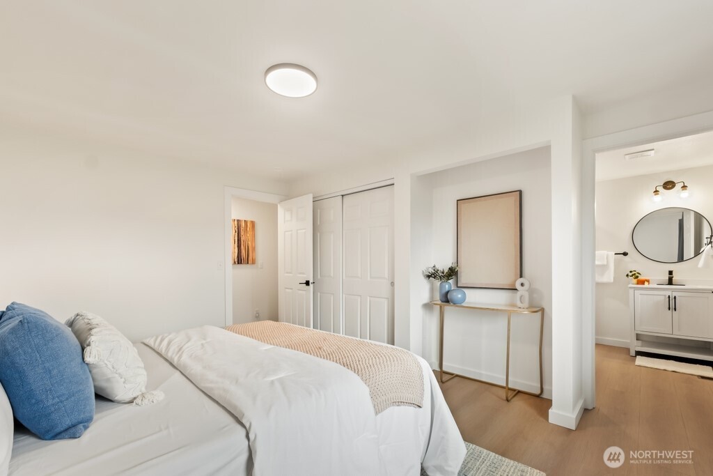 13121 Golden Given Road East Tacoma, WA 98445 - Photo 22 of 39 a bedroom with a bed and a view of bathroom