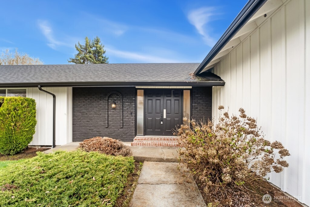 13121 Golden Given Road East Tacoma, WA 98445 - Photo 3 of 39 a front view of a house with a yard