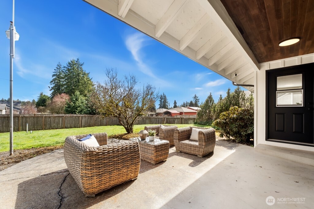 13121 Golden Given Road East Tacoma, WA 98445 - Photo 36 of 39 a view of a patio with couches chairs and a fire pit