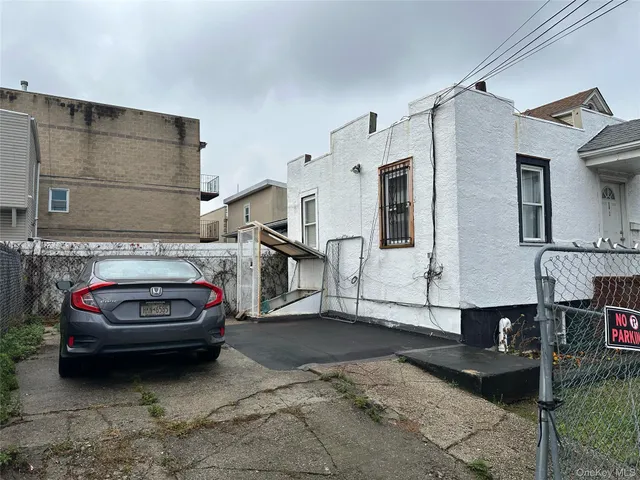 a view of a car parked in front of a house