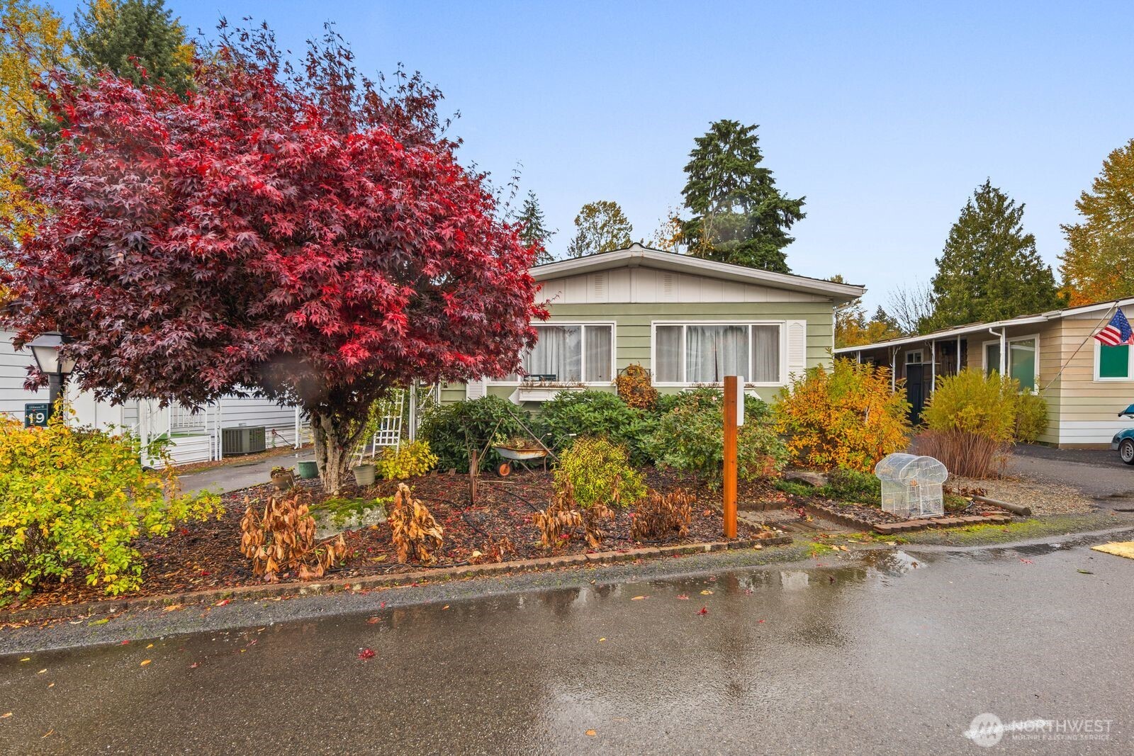 a front view of a house with sitting area