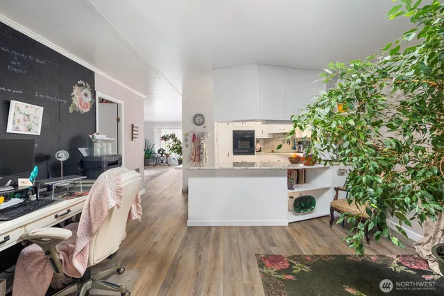 an outdoor living area with furniture and a potted plant