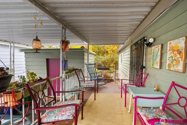 a view of living room with a fireplace and potted plants