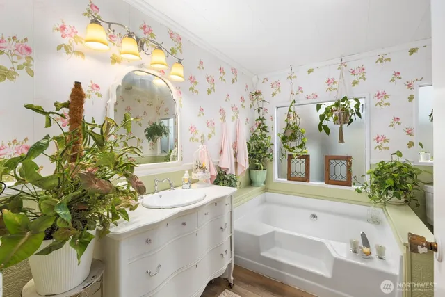 a bathroom with a sink and mirror