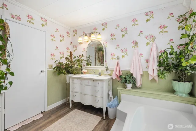 a view of a house with a backyard and sitting area