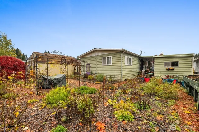 a view of a house with a outdoor space and porch