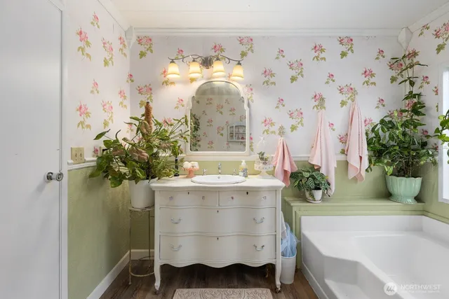 a bathroom with a sink and mirror