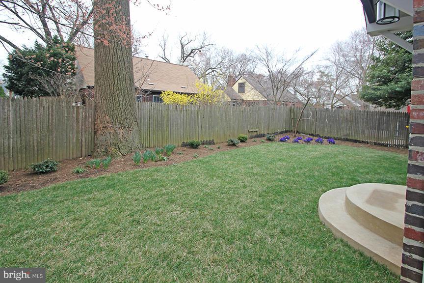 2012 Lansdowne Way Silver Spring, MD 20910 - Photo 22 of 24 a view of a backyard with table and chairs and wooden fence