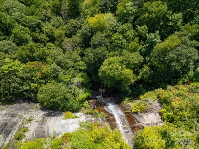 a view of a field with an ocean view
