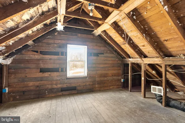 a view of a room with stairs and a window