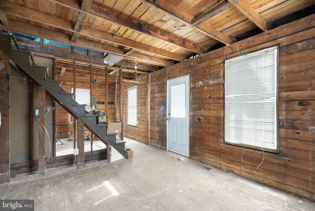 a view of an empty room with stairs