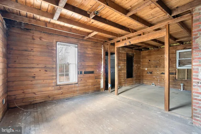 a view of a room with wooden walls