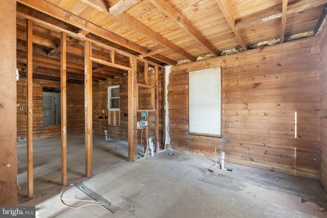 a view of a room with wooden walls