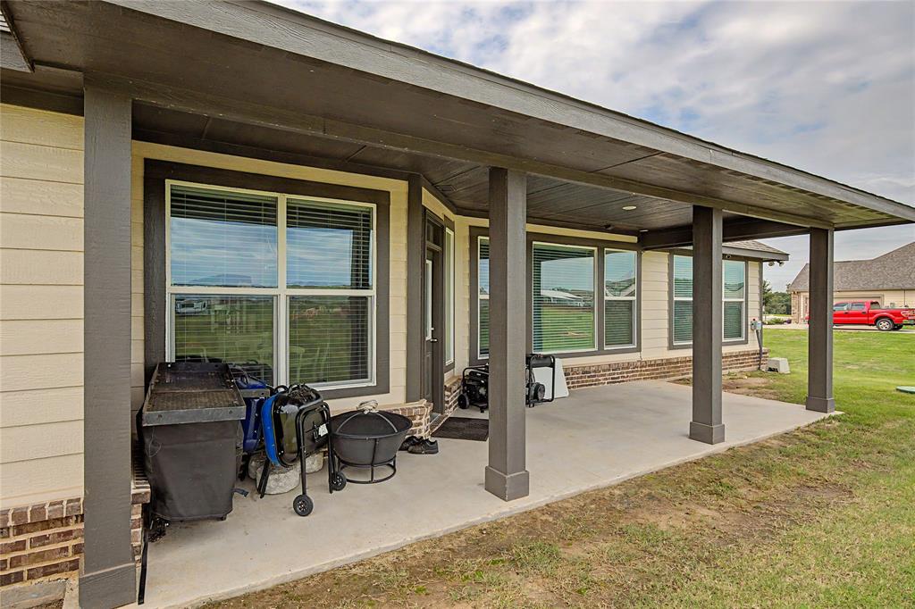 185 Chester Road Springtown, TX 76082 - Photo 39 of 40 Covered patio with concrete flooring