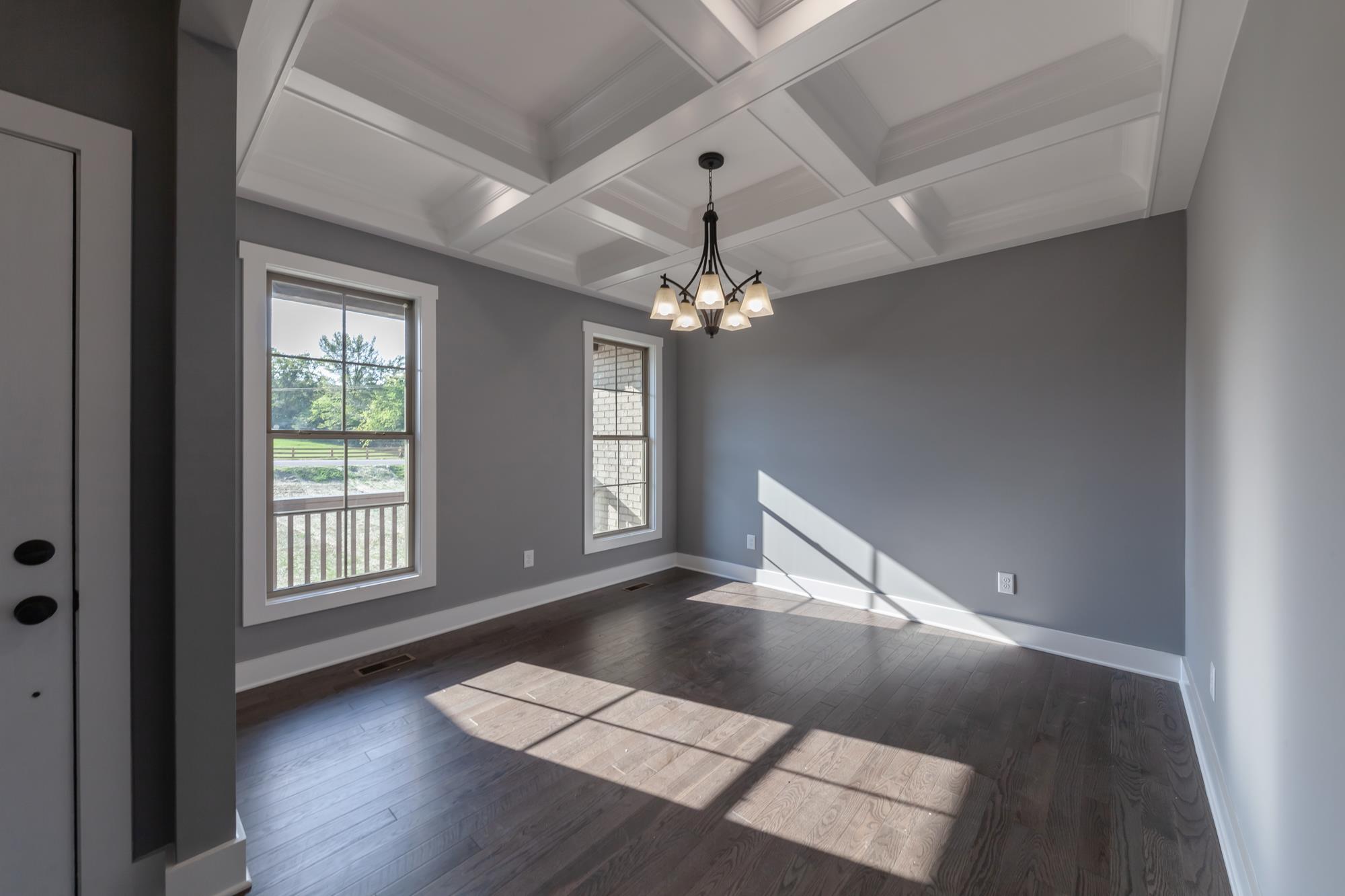 585 Sugar Flat Road Lebanon, TN 37087 - Photo 5 of 29 a view of an empty room with wooden floor and a window