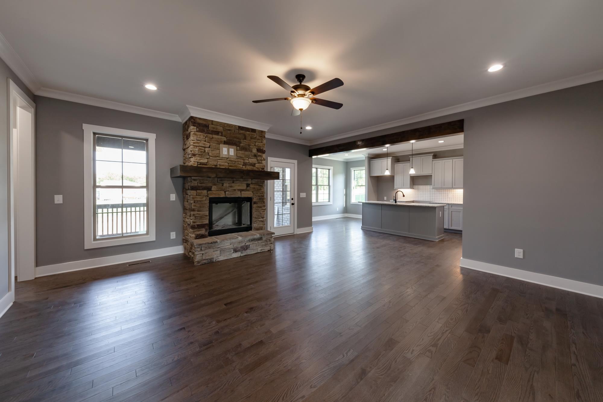 585 Sugar Flat Road Lebanon, TN 37087 - Photo 8 of 29 a view of a livingroom with fireplace wooden floor and windows