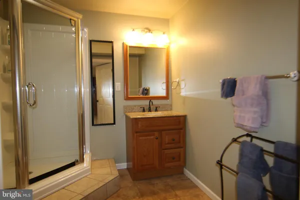 a kitchen with refrigerator and microwave