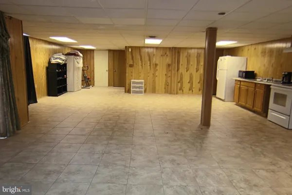 a view of an empty room with closet