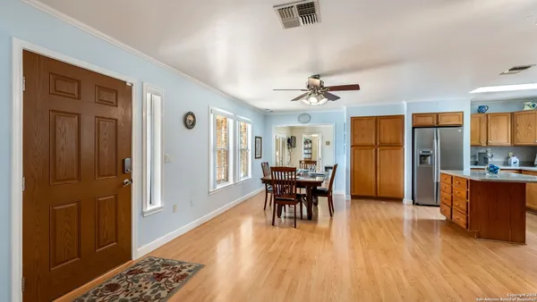 a view of kitchen with furniture and wooden floor
