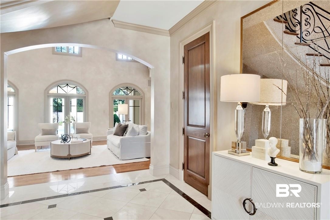 4 Chancery Court Mobile, AL 36608 - Photo 4 of 54 Interior space featuring french doors, tile walls, and crown molding