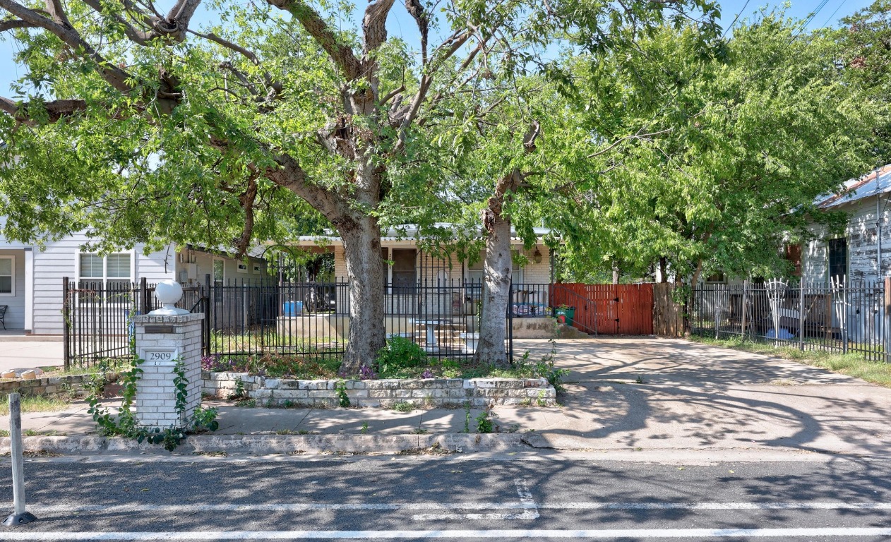 2909 East 5th Street Austin, TX 78702 - Photo 19 of 20 a front view of a house with garden