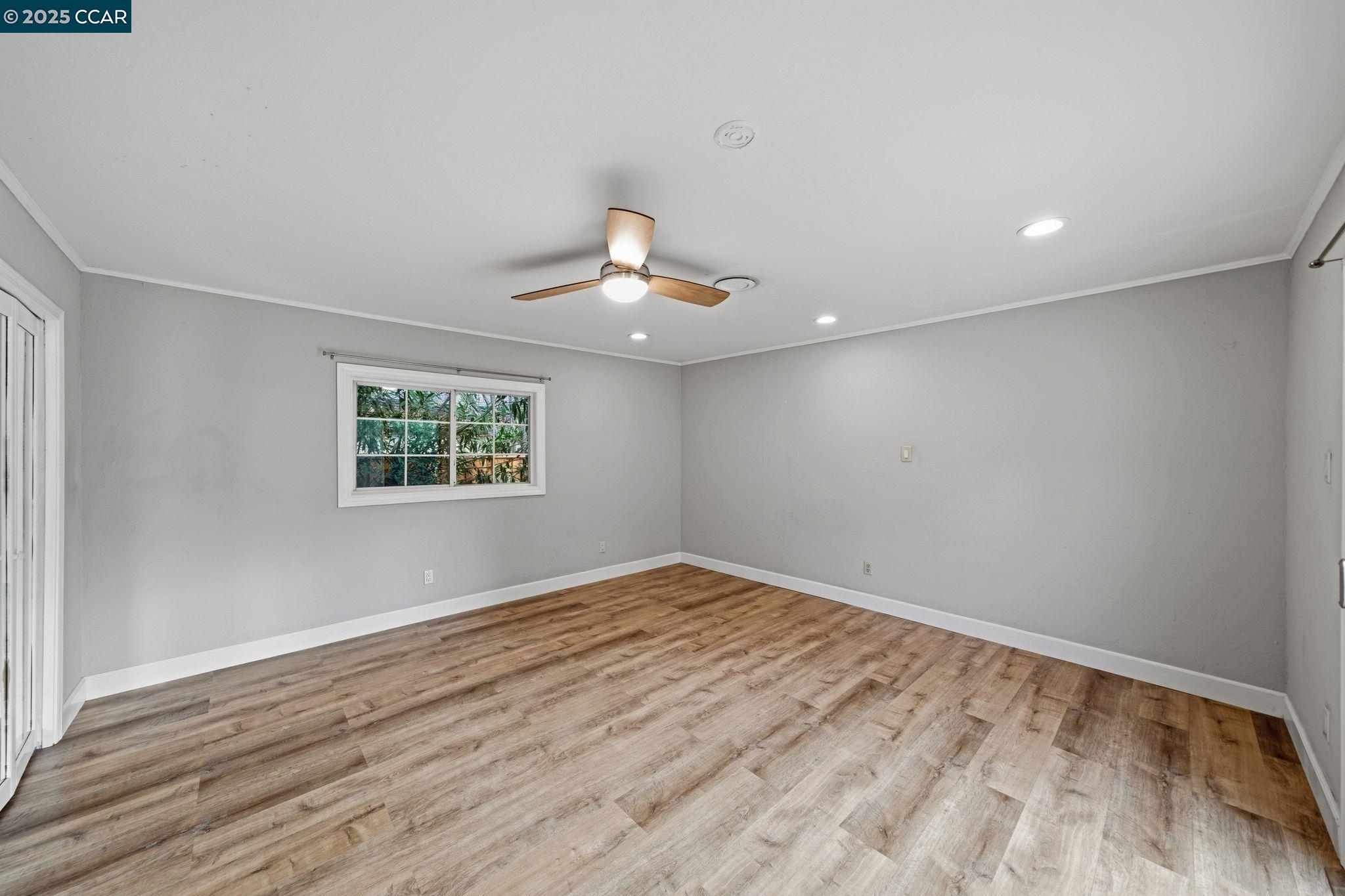 726 Grayson Road Pleasant Hill, CA 94523 - Photo 12 of 27 wooden floor in an empty room with a window