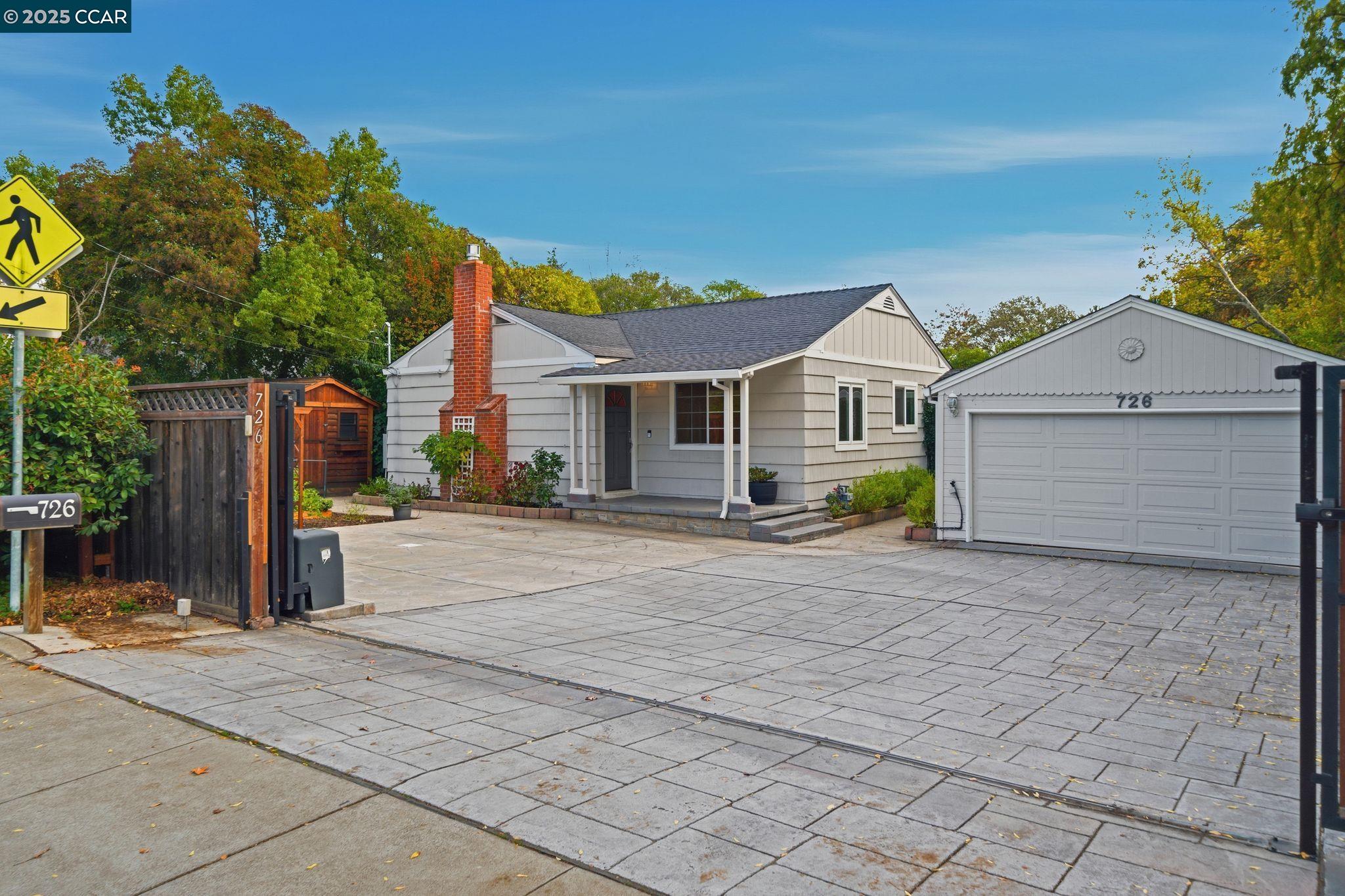 726 Grayson Road Pleasant Hill, CA 94523 - Photo 27 of 27 a front view of a house with a yard and garage