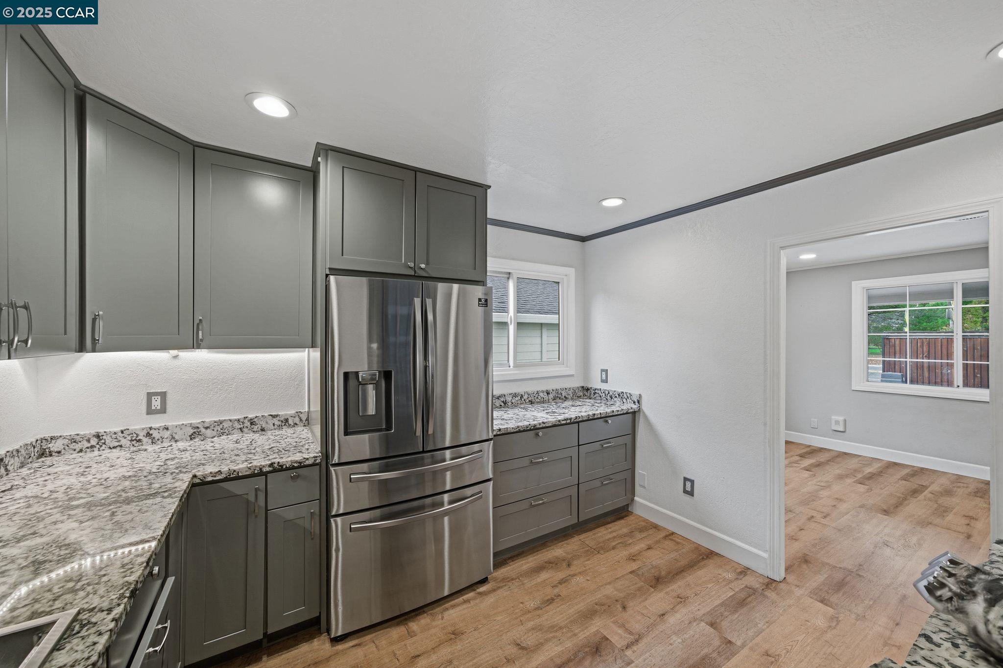 726 Grayson Road Pleasant Hill, CA 94523 - Photo 6 of 27 a kitchen with stainless steel appliances granite countertop a refrigerator and a sink