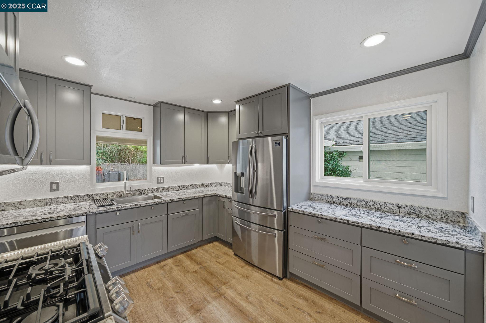726 Grayson Road Pleasant Hill, CA 94523 - Photo 7 of 27 a kitchen with sink cabinets and window