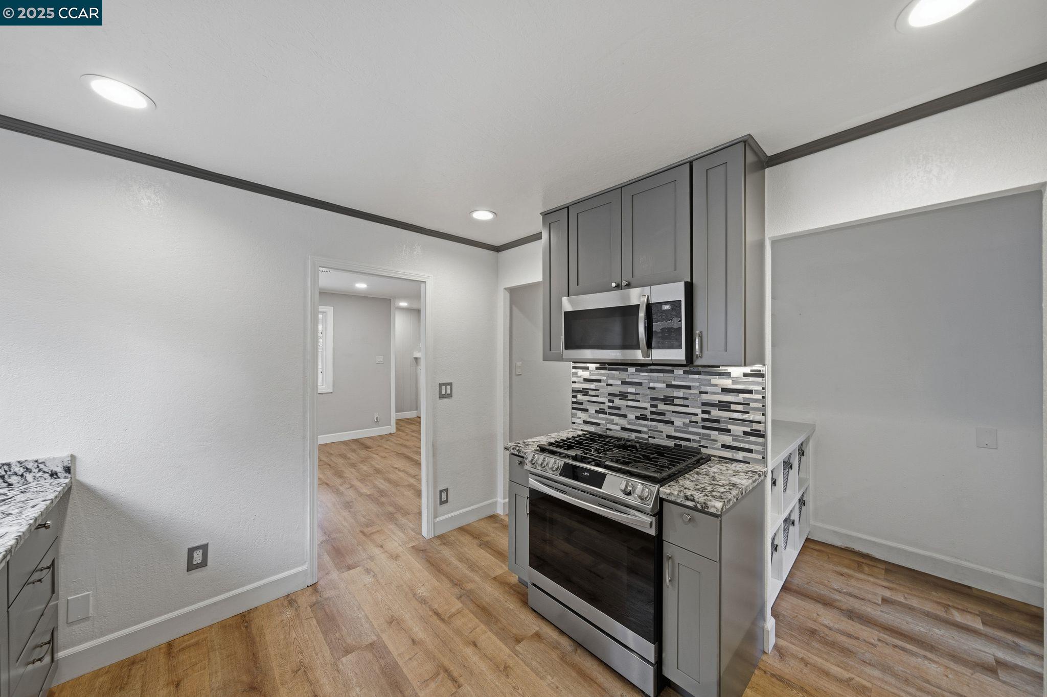 726 Grayson Road Pleasant Hill, CA 94523 - Photo 8 of 27 a kitchen with stainless steel appliances granite countertop a stove and a refrigerator