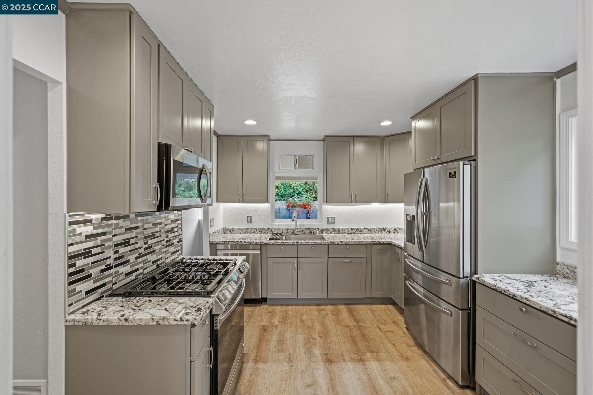 726 Grayson Road Pleasant Hill, CA 94523 - Photo 9 of 27 a kitchen with stainless steel appliances granite countertop a sink stove and refrigerator