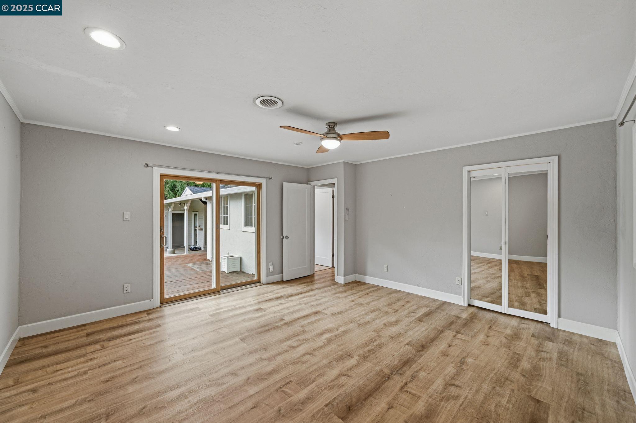 726 Grayson Road Pleasant Hill, CA 94523 - Photo 10 of 27 a view of an empty room with wooden floor and a window