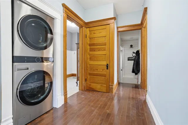 a view of a hallway with washer and dryer