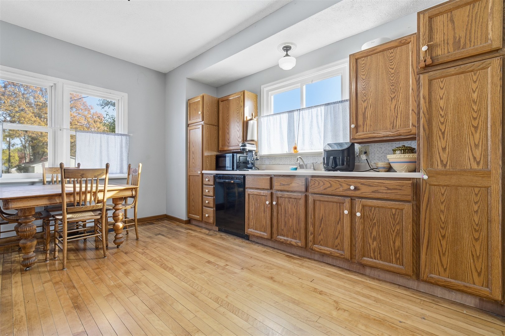 208 North Jackson Street Flanagan, IL 61740 - Photo 14 of 30 a kitchen with sink cabinets and wooden floor