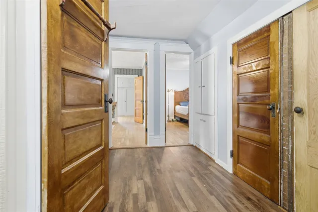 a view of walk in closet with empty racks