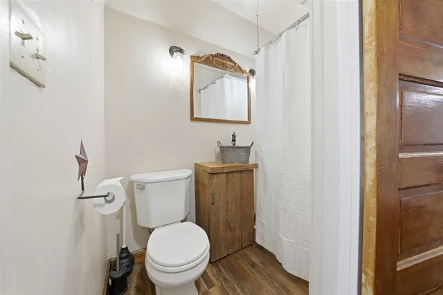 a white toilet sitting next to a bathroom sink