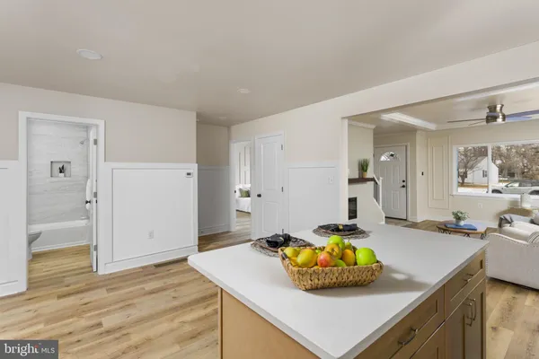 a kitchen with a sink a stove and cabinets