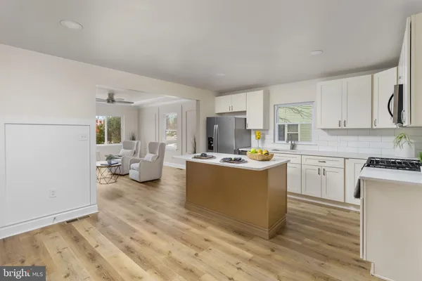 a kitchen with a refrigerator and a sink