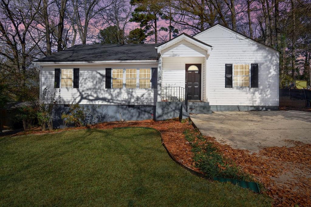 1917 Spring Avenue Atlanta, GA 30344 - Photo 21 of 22 a view of a house with backyard and garden